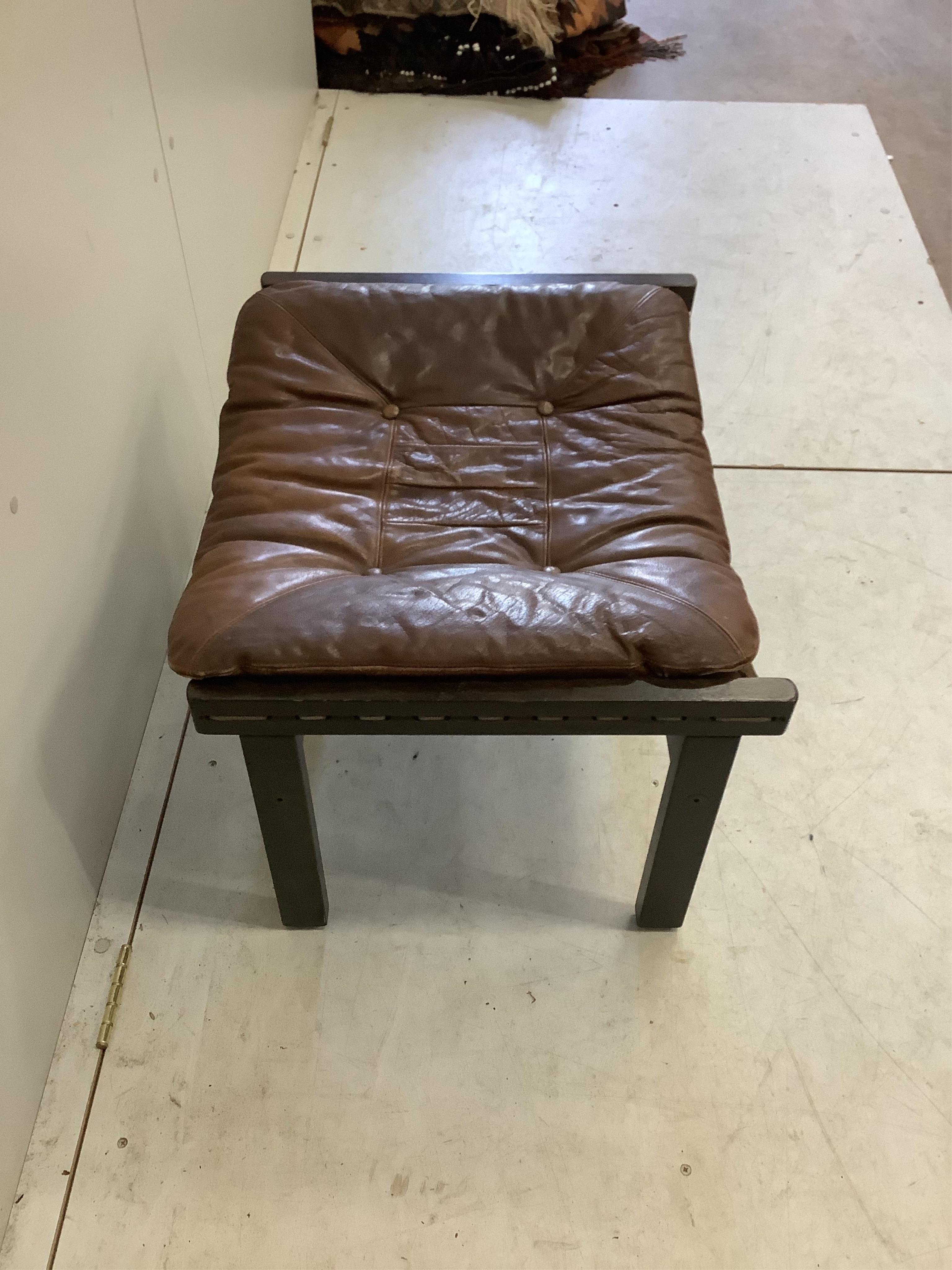 A Torbjorn Afdal 'Hunter' foot stool, width 63cm, depth 51cm, height 40cm. Condition - fair